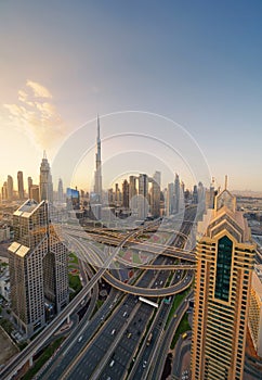 Aerial view of Dubai Downtown skyline, highway roads or street in United Arab Emirates or UAE. Financial district and business