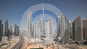 Aerial view of Dubai Downtown skyline with many towers all day timelapse.