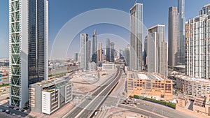 Aerial view of Dubai Downtown skyline with many towers all day timelapse.