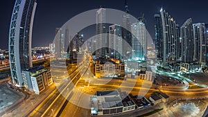 Aerial view of Dubai Downtown skyline with many towers all night timelapse.