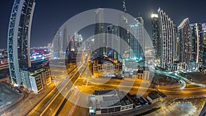 Aerial view of Dubai Downtown skyline with many towers night timelapse.