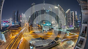 Aerial view of Dubai Downtown skyline with many towers night timelapse.