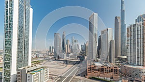 Aerial view of Dubai Downtown skyline with many towers timelapse.