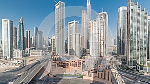 Aerial view of Dubai Downtown skyline with many towers timelapse.