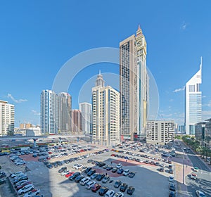 Aerial view of Dubai Downtown skyline with parking in United Arab Emirates or UAE. Financial district and business area in smart