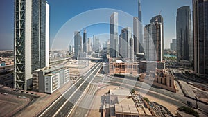 Aerial view of Dubai Downtown skyline during sunrise with many towers timelapse.