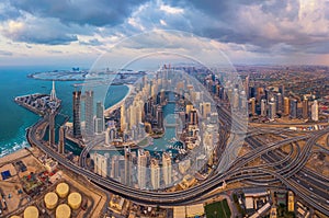 Aerial view of Dubai Marina and highways, Downtown skyline, United Arab Emirates or UAE. Financial district and business area in