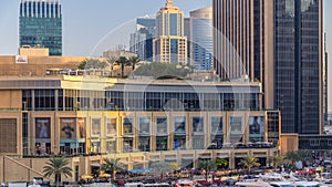 Aerial view of Dubai Marina with shopping mall, restaurants, towers and yachts timelapse, United Arab Emirates.