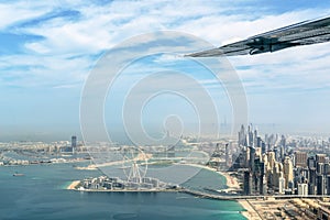 Aerial view of Dubai Marina skyline with Dubai Eye ferris wheel, UAE