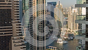 Aerial view on Dubai Marina skyscrapers and the most luxury yacht in harbor timelapse, Dubai, United Arab Emirates