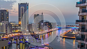 An Aerial view of Dubai Marina Towers in Dubai day to night timelapse