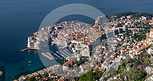 Aerial view of Dubrovnik, with colorful buildings and boats in the harbor. Croatia.