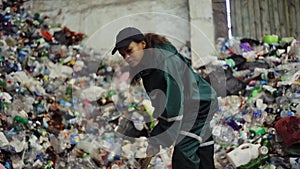 Aerial view. A dump truck unloads a pile of garbage at a landfill. Dump of unsorted waste. Drone shot of working trash