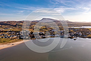 Aerial view of Dunfanaghy with the Muckish in background in County Donegal at sunset - Ireland photo