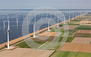 Aerial view Dutch landscape with offshore wind turbines along coast photo