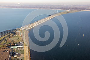 Aerial view Dutch Haringvliet dam with motorway in wintertime