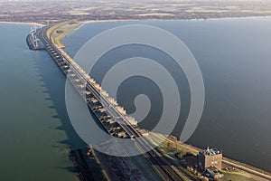 Aerial view Dutch Haringvliet dam with motorway in wintertime