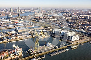 Aerial view Dutch industrial park with harbors and ships