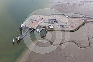 Aerial view Dutch island Schiermonnikoog with pier and ferry terminal