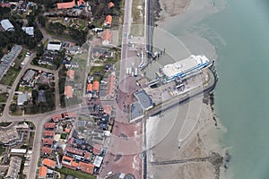 Aerial view Dutch island Vlieland with pier and ferry terminal photo