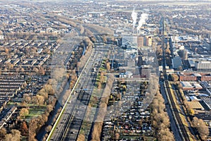 Aerial view Dutch residential area Rotterdam with freeway and railway