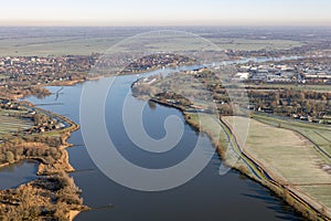 Aerial view Dutch river Lek with view at village Schoonhoven