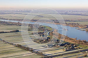 Aerial view Dutch river Lek with view at village Schoonhoven