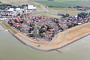 Aerial view Dutch village Hindeloopen at lake IJsselmeer with marina