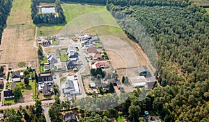 Aerial view of the edge of a German village, which is growing by the designation of new building areas for single-family houses.