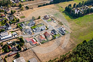 Aerial view of the edge of a German village, which is growing by the designation of new building areas for single-family houses.