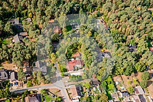 Aerial view of the edge of a village with small family houses, w