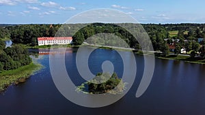 erial View of Edole Village, Edole Medieval Castle and Lake in Sunny Summer, Latvia, Courland Kurzeme, Western Latvia. History, photo