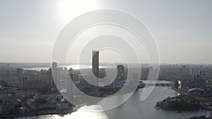 Aerial view of Ekaterinburg city with a river Iset and high rise buildings, Russia. Stock footage. Flying over the city