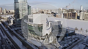 Aerial view of Ekaterinburg city in Russia with modern glass facade buildings. Action. Flying over historical museum