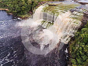 Aerial view of El Hacha waterfall at sunrise.