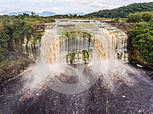 Aerial view of El Hacha waterfall at sunrise.