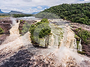 Aerial view of El Hacha waterfall at sunrise. Canaima National Park