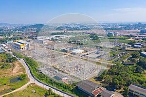 Aerial view of electricity generating, voltage poles. Power lines on utility tower and cable wires in energy electric technology,