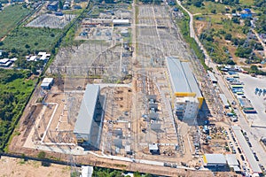 Aerial view of electricity generating, voltage poles. Power lines on utility tower and cable wires in energy electric technology,