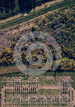 Aerial view of electricity power substation plant and pylons