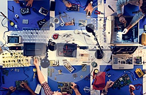 Aerial view of electronics technicians team working on computer parts