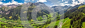 Aerial view of Elm village and Swiss mountains - Piz Segnas, Piz Sardona, Laaxer Stockli from Ampachli, Glarus, Switzerland, Europ