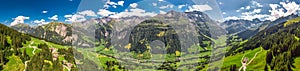 Aerial view of Elm village and Swiss mountains - Piz Segnas, Piz Sardona, Laaxer Stockli from Ampachli, Glarus, Switzerland, Europ