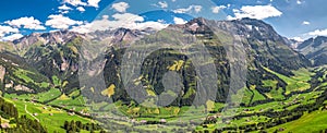 Aerial view of Elm village and Swiss mountains - Piz Segnas, Piz Sardona, Laaxer Stockli from Ampachli, Glarus, Switzerland, Europ photo