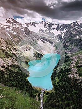 Aerial view of emerald lake in the mountain circus. National Park and natural attractions. Wilderness and outdoor recreation