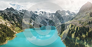 Aerial view of emerald lake in the mountain circus. National Park and natural attractions. Wilderness and outdoor recreation