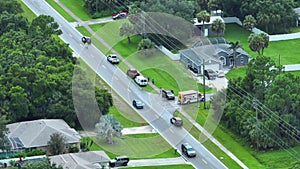 Aerial view of emergency services personnel and vehicles responding to accident site on american street. First