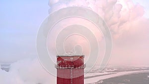 Aerial view. Emission to atmosphere from industrial pipes. Smokestack pipes shooted with drone