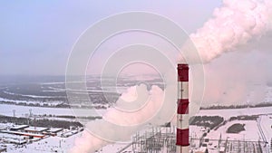 Aerial view. Emission to atmosphere from industrial pipes. Smokestack pipes shooted with drone