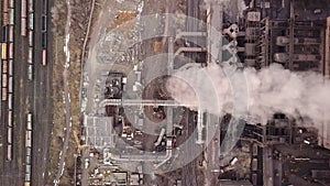 Aerial view. Emission to atmosphere from industrial pipes. Smokestack pipes shooted with drone. Close-up.